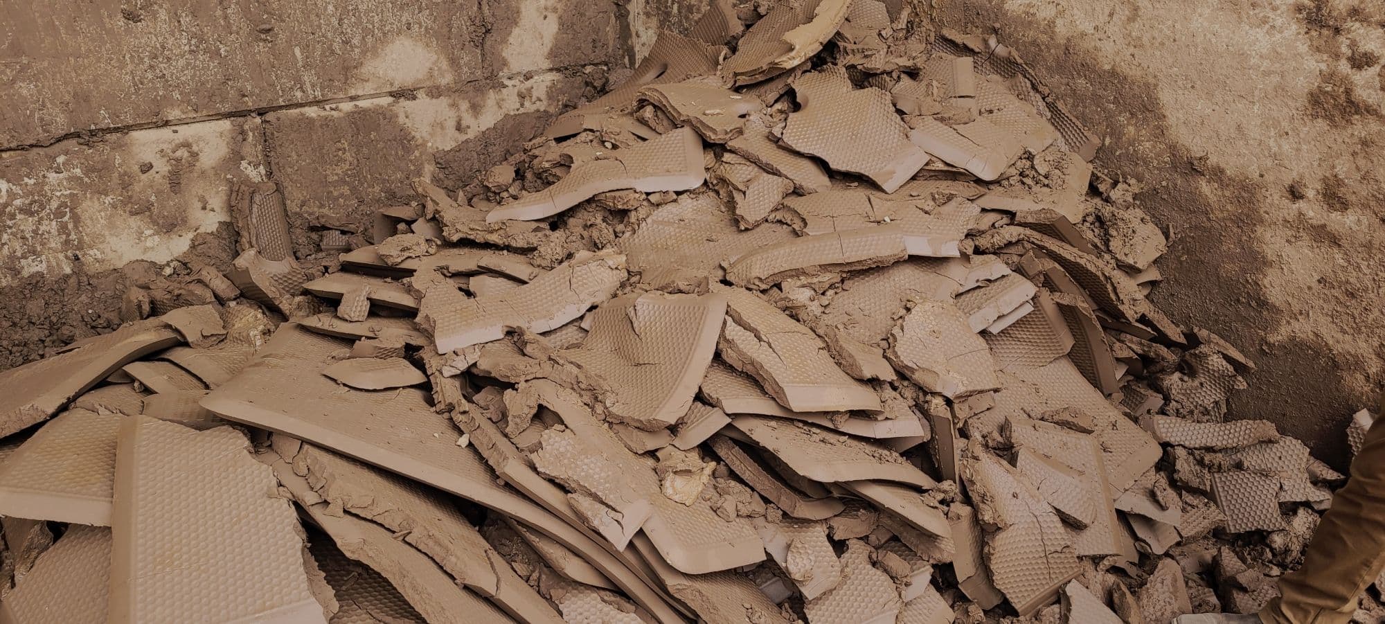 Filter cakes produced through industrial soil washing systems.